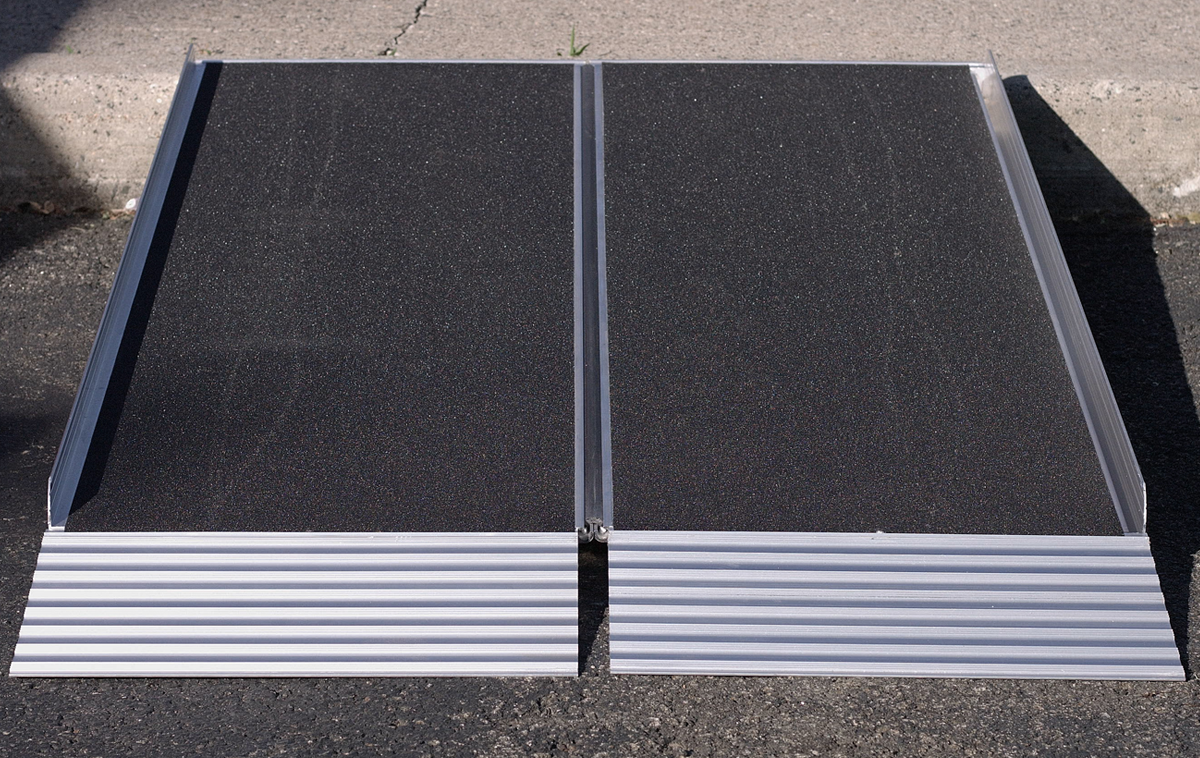 A rectangular piece of corrugated metal decking with raised edges and a ribbed surface, typically used in construction for floors or roofs.