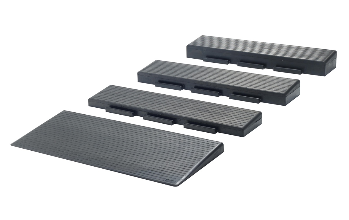 A rectangular black anti-fatigue floor mat with a textured, grid-like pattern and beveled edges, viewed from an angle against a white background.
