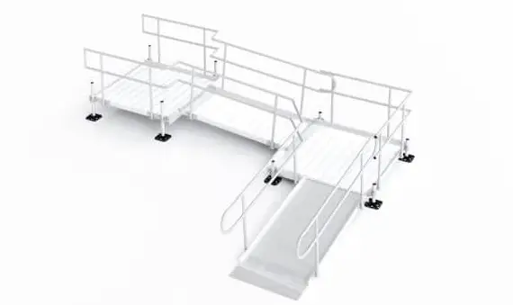 A modular, white, metal wheelchair ramp system with handrails, support posts, and two platforms connected by angled ramps, designed for accessibility.