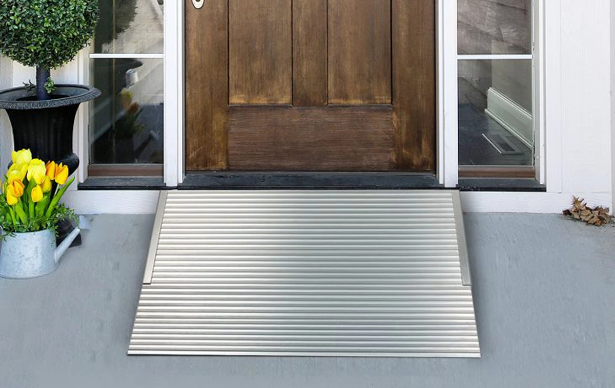 A rectangular metal mat with two wide, parallel silver stripes running vertically near the edges, placed on a plain white surface.